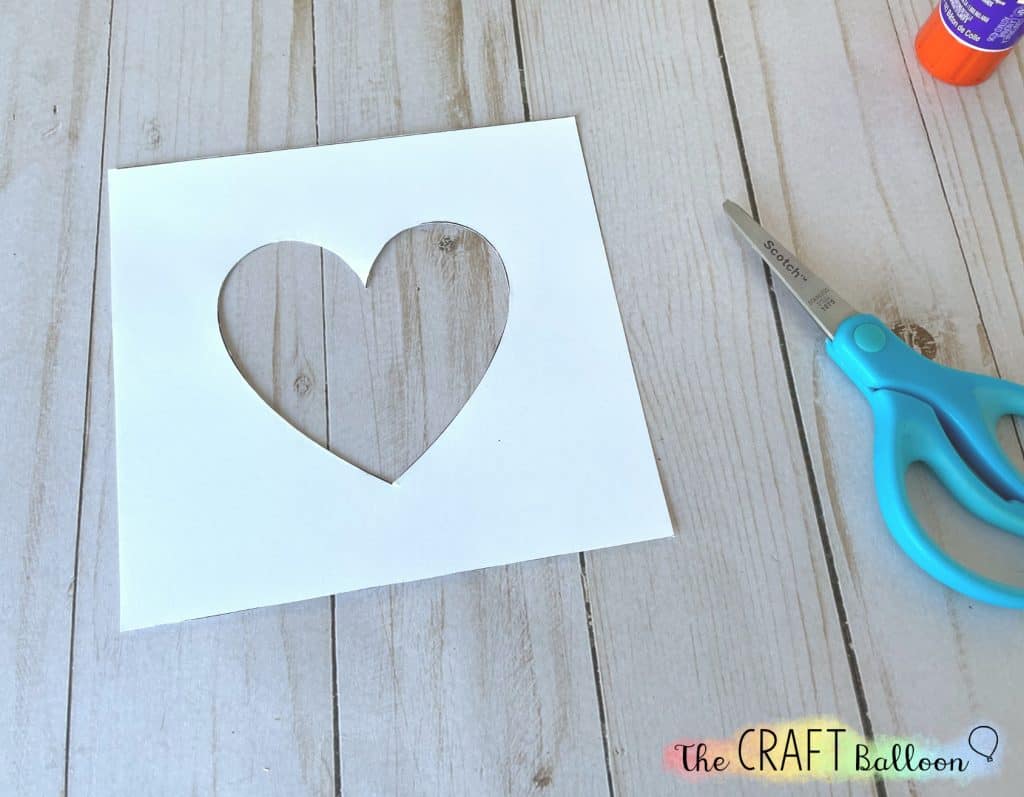 Card template with heart shaped cut out.