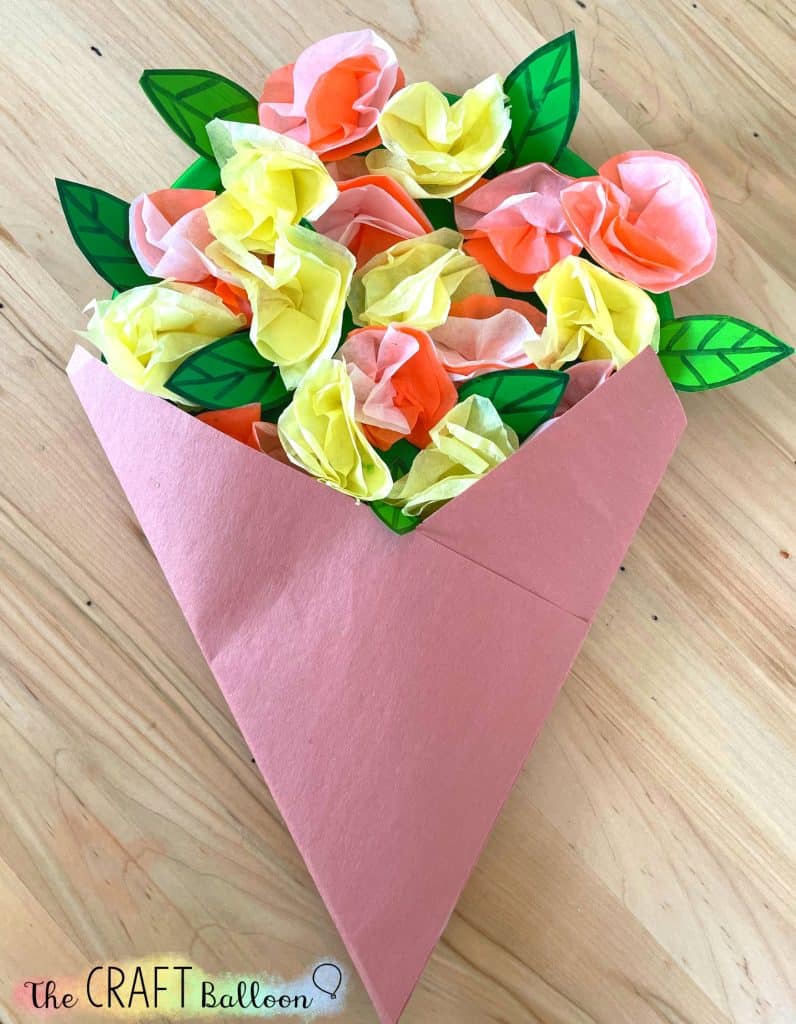 folded sugar paper with paper plate flowers attached